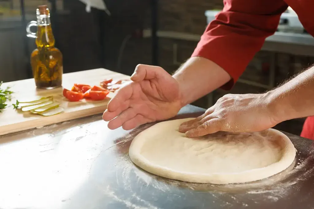 shaping-Nanny-Pizza-dough-in-the-kitchen