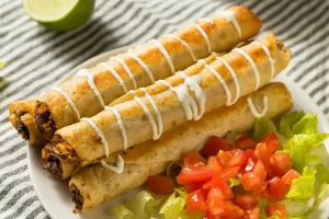 homemade-mexican-chicken-flautas-with-crema-2023-11-27-05-05-34-utc